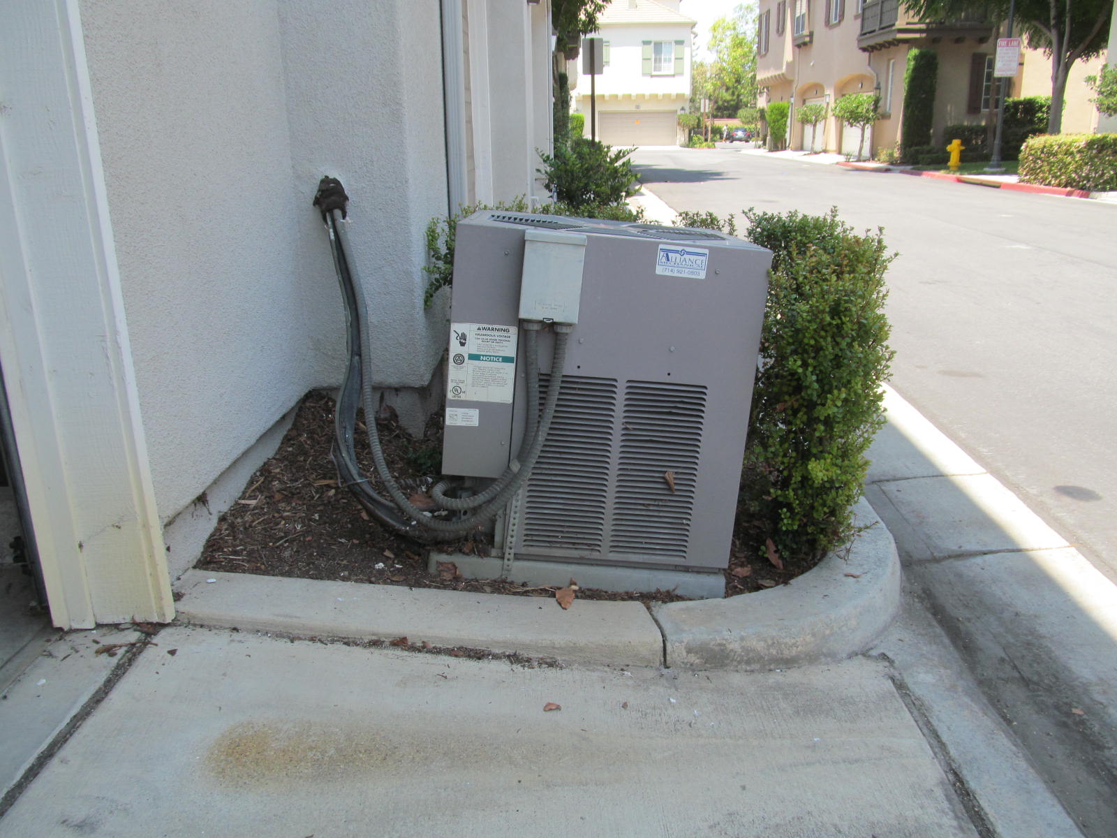 A/C on exterior pad - not level
