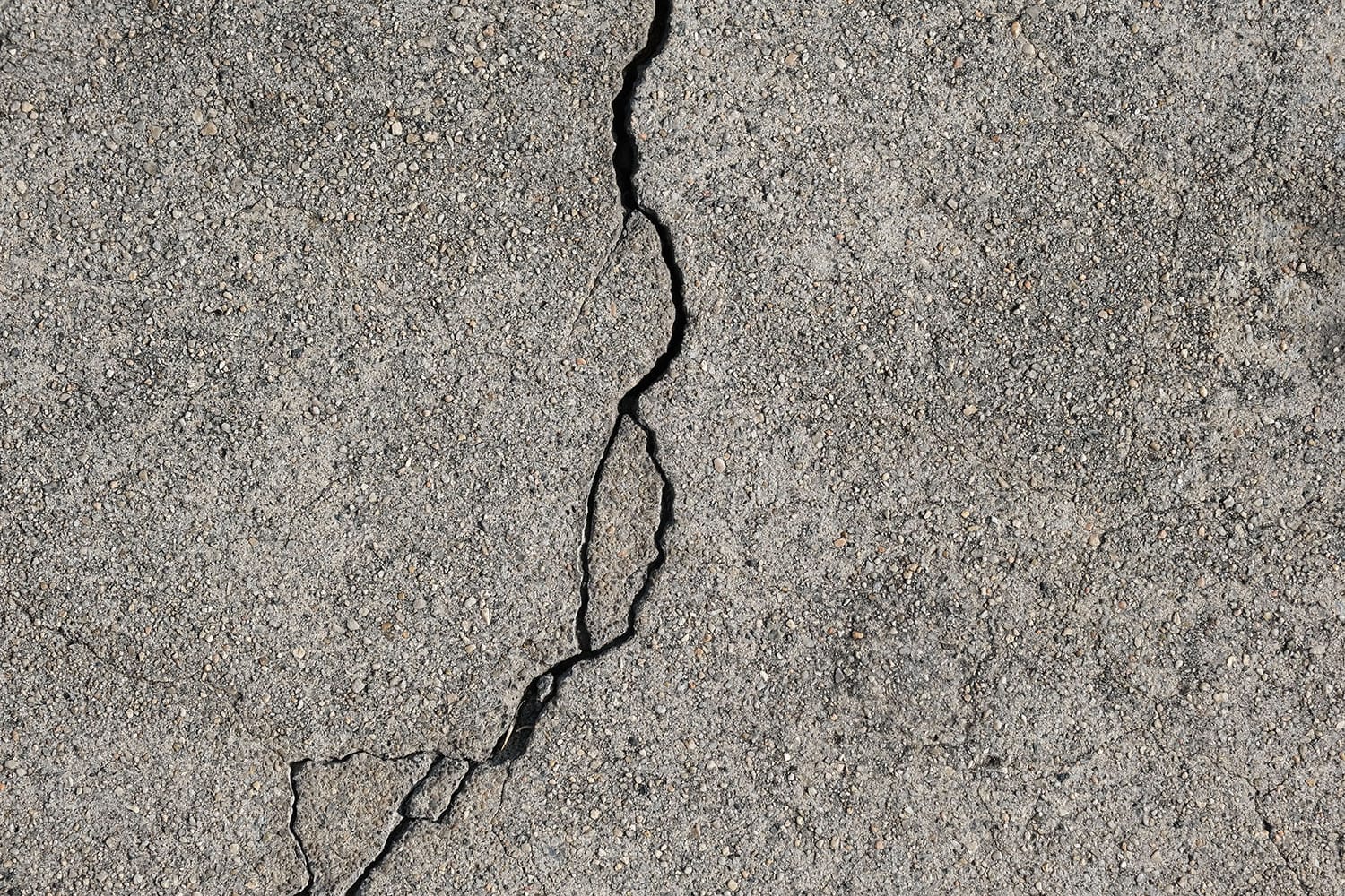 Concrete cracks with loose edges