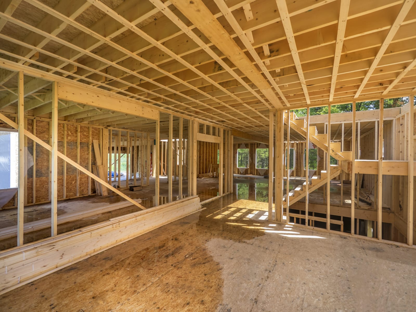 A house in the framing process with sloping floor
