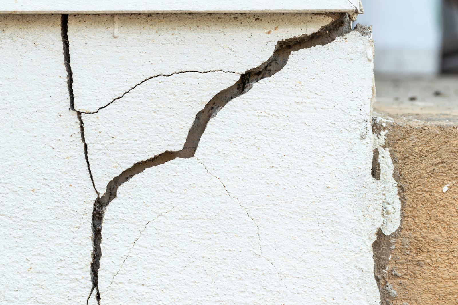 Large crack at corner of wall