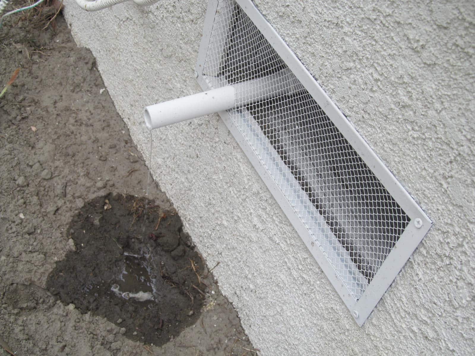 Condensate Dripping Next To The Homes Foundation From The A/C Is A Problem
