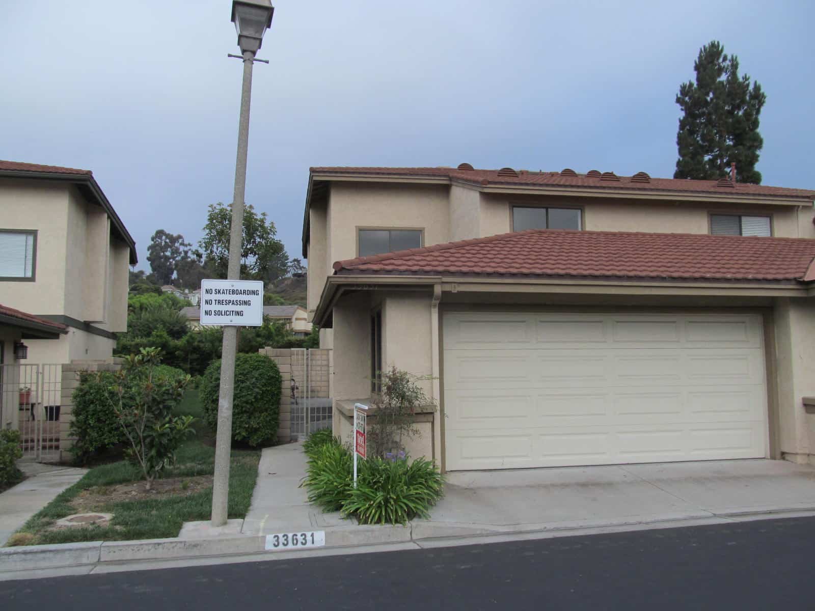 Leaning light pole indicates soil movement