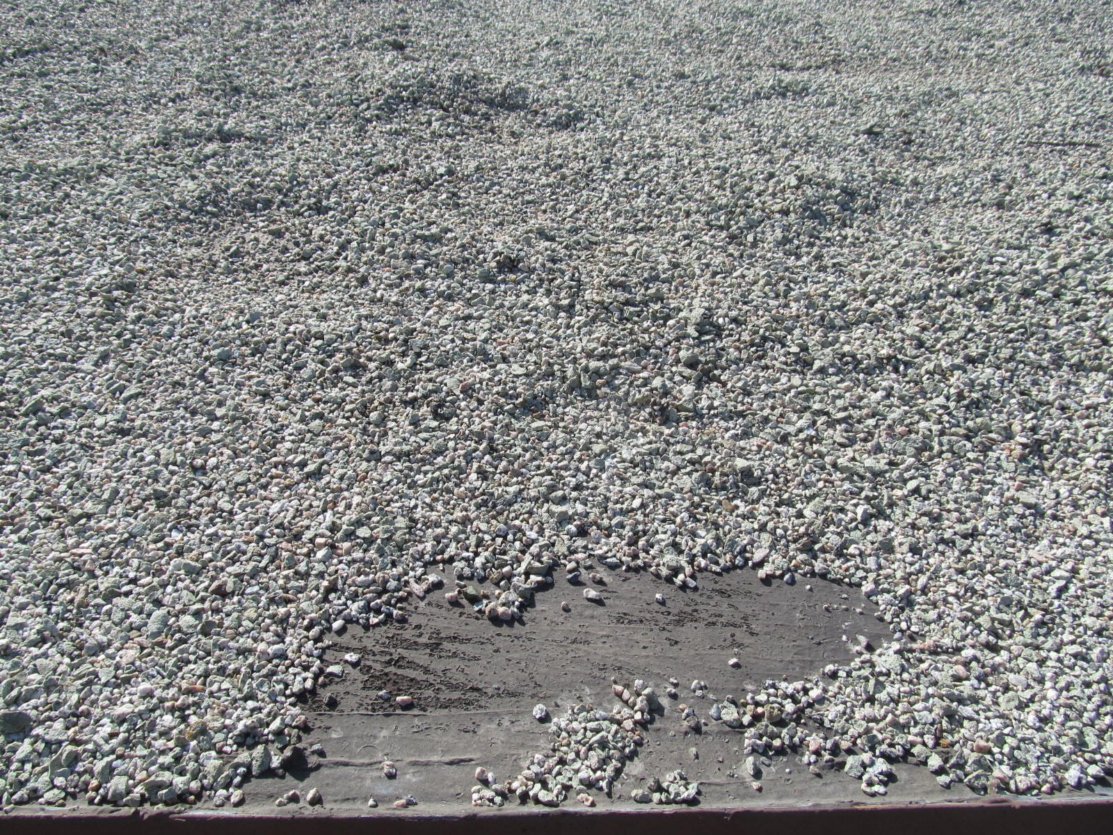 Gravel Voids On Flat Roofs May Shorten the Life Expectancy or Cause Leaking