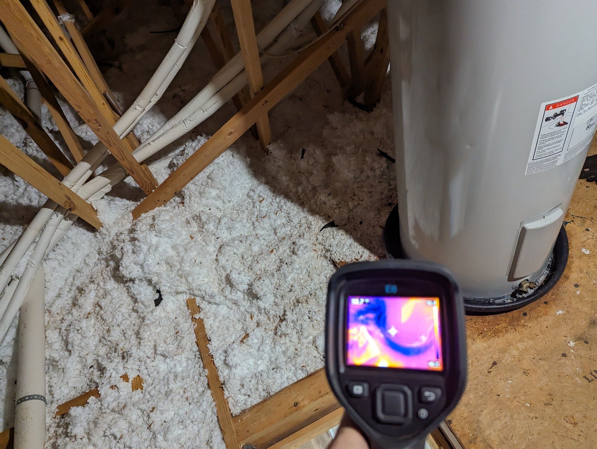 leaking water heater in attic heat gun showing leak