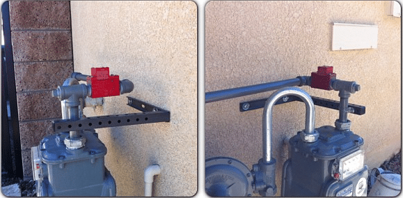 newly installed red earthquake shut off valve and new gas pipe on meter