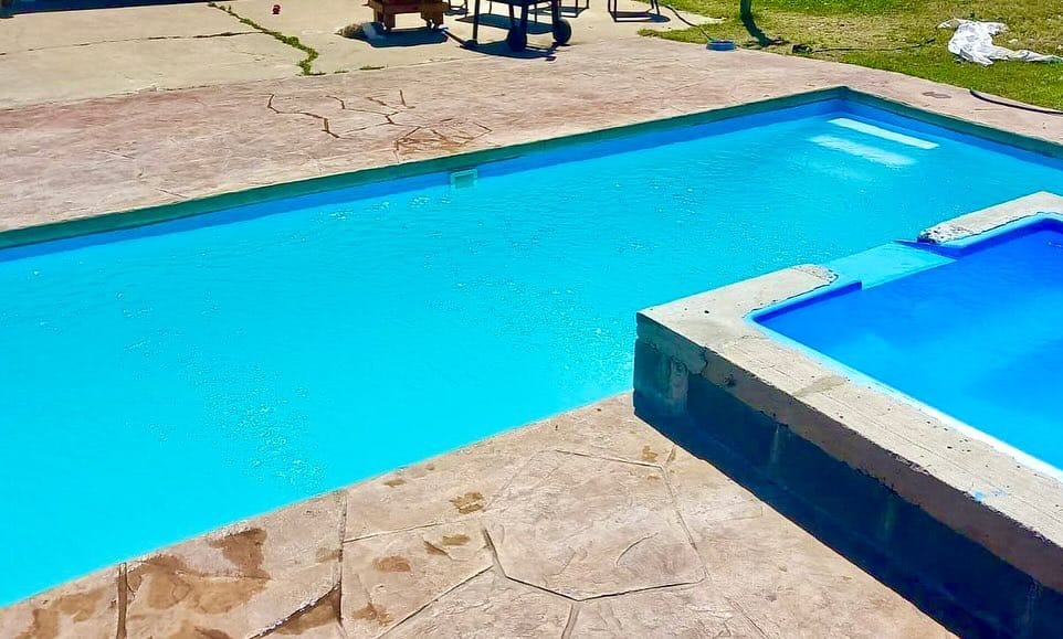 freshly cleaned pool with sparkling blue water