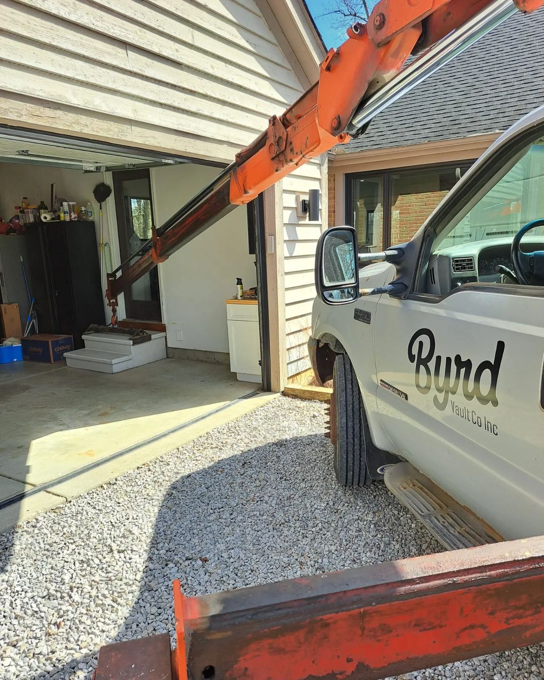 concrete steps being installed in a garage by crane